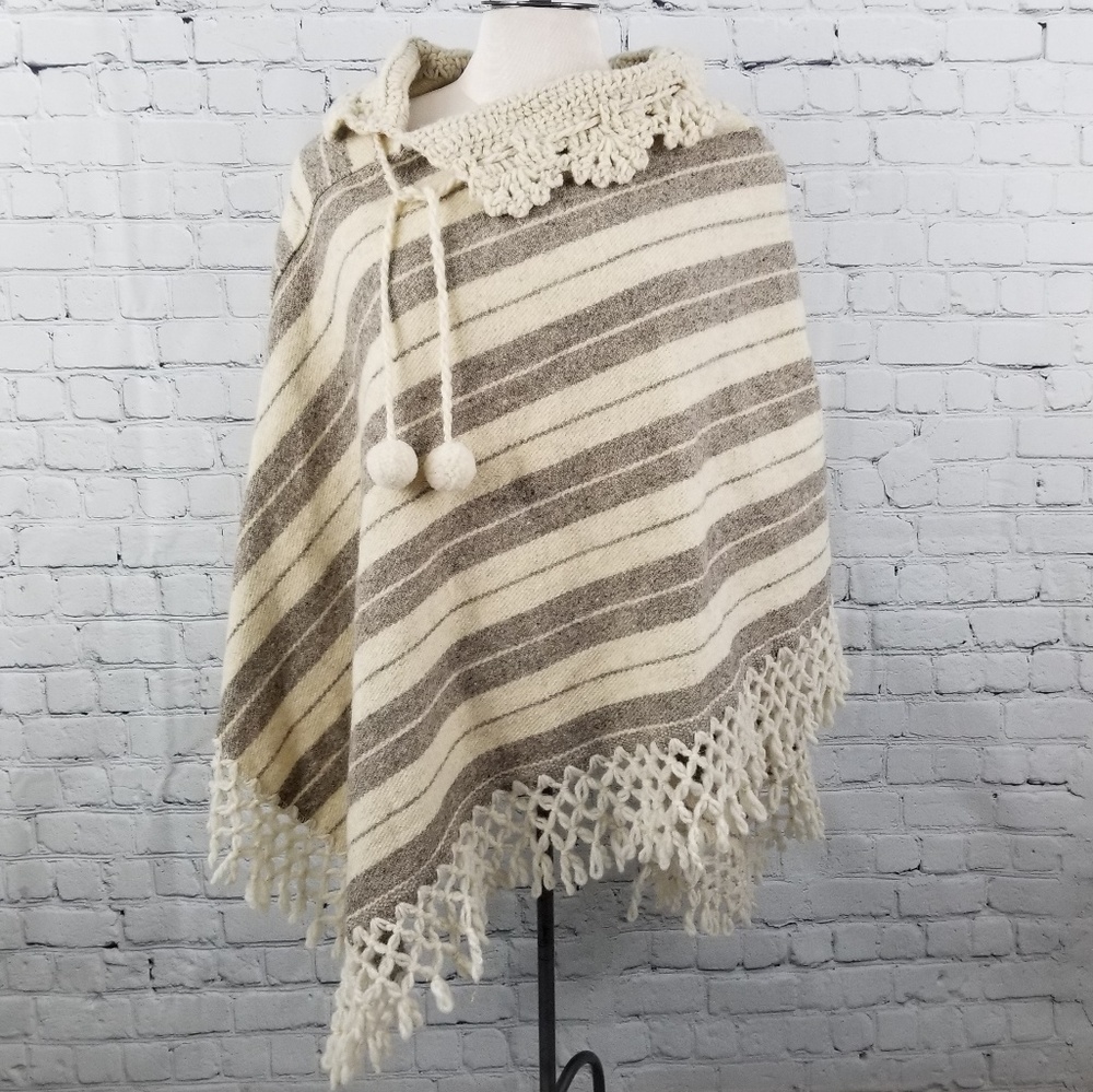 Diagonal striped asymmetrical hem crocheted fringe wool poncho
